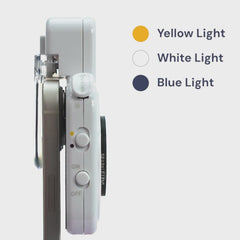 GemSparkle side view clipped to a smartphone, showing the light mode switch for yellow, white and blue light and the on/off control